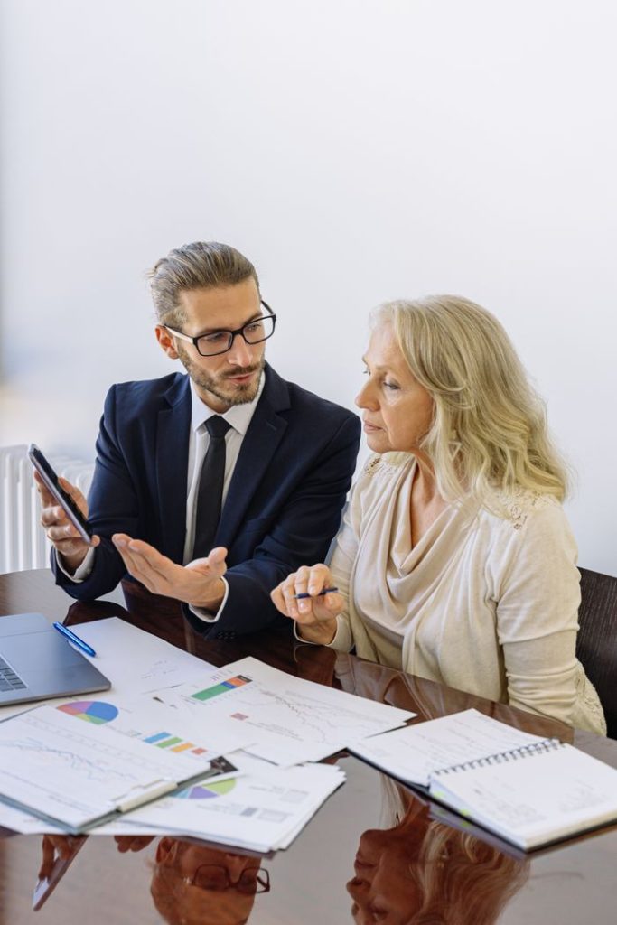 Mastering the First Impression: Your intriguing post title goes here Professional business discussion between a consultant and client in an office setting.